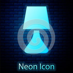 Glowing neon Table lamp icon isolated on brick wall background. Desk lamp. Vector