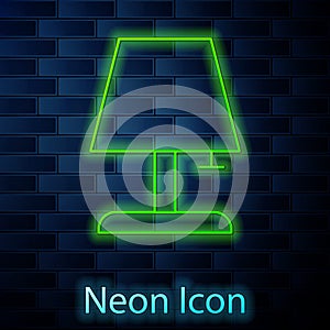 Glowing neon Table lamp icon isolated on brick wall background. Vector