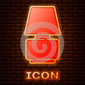 Glowing neon Table lamp icon isolated on brick wall background. Vector