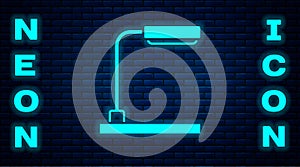 Glowing neon Table lamp icon isolated on brick wall background. Vector