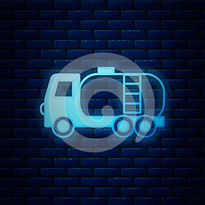 Glowing neon Tanker truck icon isolated on brick wall background. Petroleum tanker, petrol truck, cistern, oil trailer