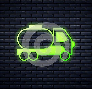 Glowing neon Tanker truck icon isolated on brick wall background. Petroleum tanker, petrol truck, cistern, oil trailer