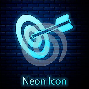 Glowing neon Target financial goal concept icon isolated on brick wall background. Symbolic goals achievement, success