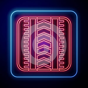 Glowing neon Tire track icon isolated on black background. Vector