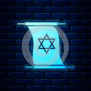 Glowing neon Torah scroll icon isolated on brick wall background. Jewish Torah in expanded form. Torah Book sign. Star