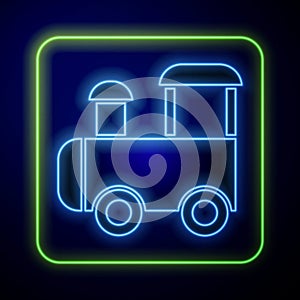 Glowing neon Toy train icon isolated on blue background. Vector