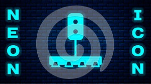 Glowing neon Train traffic light icon isolated on brick wall background. Traffic lights for the railway to regulate the