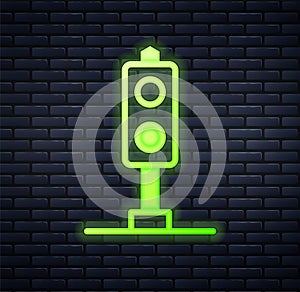 Glowing neon Train traffic light icon isolated on brick wall background. Traffic lights for the railway to regulate the