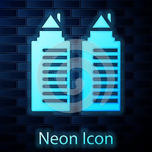 Glowing neon Two tall residential towers in the Dnipro city icon isolated on brick wall background. Vector