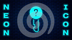 Glowing neon Undefined key icon isolated on brick wall background. Vector Illustration