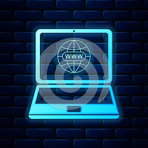 Glowing neon Website on laptop screen icon on brick wall background. Globe on screen of laptop symbol. World wide web