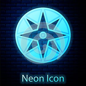 Glowing neon Wind rose icon isolated on brick wall background. Compass icon for travel. Navigation design. Vector