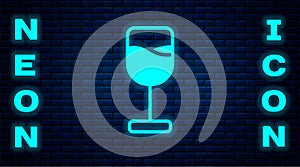 Glowing neon Wine glass icon isolated on brick wall background. Wineglass icon. Goblet symbol. Glassware sign. Happy