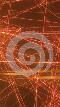 Glowing orange laser lines crossing on dark abstract background