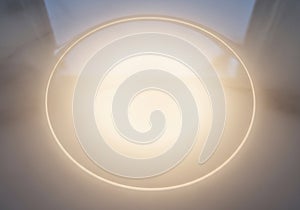 A glowing oval shape illuminates the center of the image. The