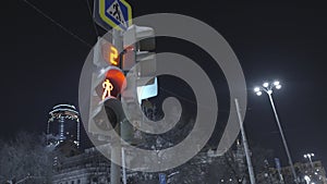 Glowing pedestrian traffic light. Action. Pedestrian traffic light switches from red to green sign indicating that you