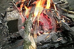 A glowing red-hot firewood