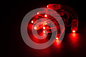 Glowing RED led pixels christmas holiday lights on black background