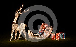Glowing Reindeer Pulling Sleigh Full of Presents