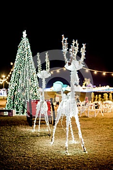 Glowing reindeer with sleighs