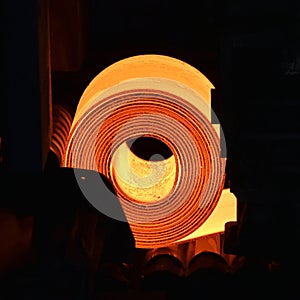 Glowing roller metal in a steel mill - industrial factory for the production of sheet metal