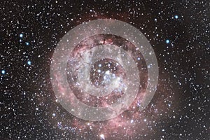 Glowing Rosette Nebula NGC 2244 of the Monoceros region of the Milky Way Galaxy