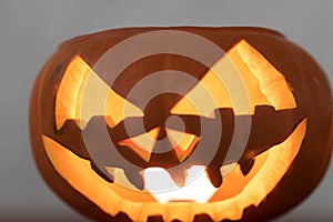 glowing scary halloween decoration jack o lantern crafted on pumpkin