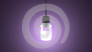 Glowing spiral light bulb hanging on violet