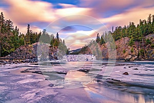 Glowing Sunrise Sky Over Bow Falls