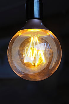 Glowing vintage light bulb.