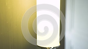 Glowing wall lamp for decorate interior in dark room. Interior lighting concept.