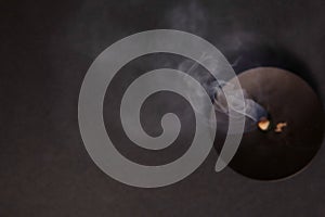 Glowing Wick and Rising Smoke in Tranquil Meditation Scene