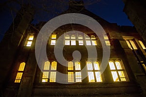 Glowing windows on a building at Yale University at night