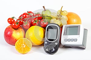 Glucometer, blood pressure monitor and fruits with vegetables, healthy lifestyle