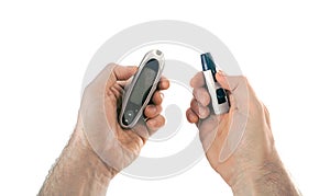 Glucometer and the lancing device in hands It is a tools of home blood glucose monitoring HBGM by people with diabetes mellitus