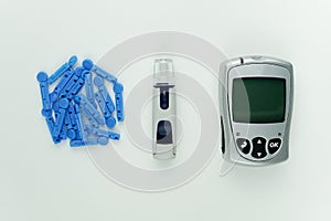 Glucometer and other blood sugar supplies.