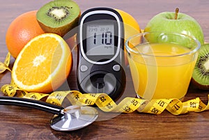 Glucometer, stethoscope, fruits, juice and centimeter, diabetes lifestyles and nutrition