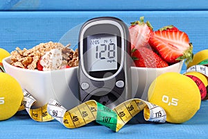 Glucometer with sugar level, healthy food, dumbbells and centimeter, diabetes, healthy and sporty lifestyle