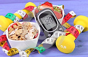 Glucometer with sugar level, healthy food, dumbbells and centimeter, diabetes, healthy and sporty lifestyle