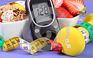 Glucometer with sugar level, healthy food, dumbbells and centimeter, diabetes, healthy and sporty lifestyle