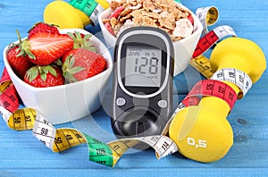 Glucometer with sugar level, healthy food, dumbbells and centimeter, diabetes, healthy and sporty lifestyle