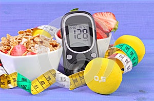 Glucometer with sugar level, healthy food, dumbbells and centimeter, diabetes, healthy and sporty lifestyle