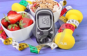 Glucometer with sugar level, healthy food, dumbbells and centimeter, diabetes, healthy and sporty lifestyle