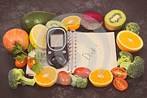Glucose meter for checking sugar level, notepad and fruits with vegetables containing vitamins. Diabetes, slimming and diet