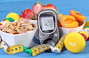 Glucose meter with result sugar level, healthy food, dumbbells and centimeter, diabetes, healthy and sporty lifestyle