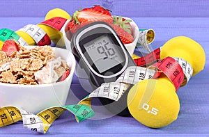 Glucose meter with sugar level, healthy food, dumbbells and centimeter, diabetes, healthy and sporty lifestyle