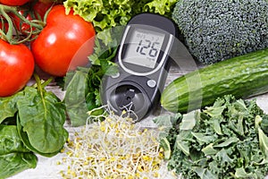 Glucose meter with vegetables and sprouts. Checking sugar level and healthy lifestyles