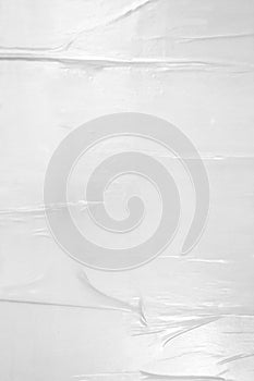 Glued wall white poster paper with air pockets and bumpy uneven application