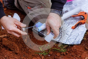 Before gluing pvc pipe, a plumber applies glue to it