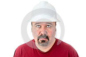 Glum looking workman looking for inspiration photo